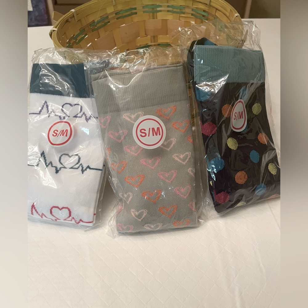 Three pairs of long compression socks in size small/med Size 5-7.5. NWOT
